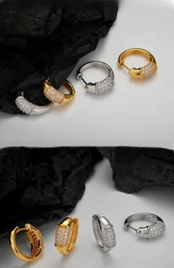 Macro detail of S925 sterling silver hoop earrings with pavé set zirconia and hinged clasp