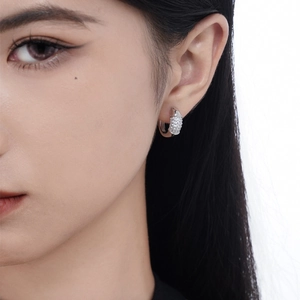 Elegant S925 sterling silver hoop earrings with pave-set zircons on an Asian model