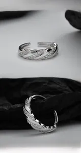 Macro shot of S925 sterling silver twisted ring featuring multi-row micro-paved zircons