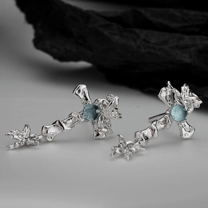 Gothic S925 sterling silver cross earrings with irregular texture and light blue gemstone