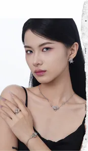 Asian model wearing a S925 silver irregular jewelry set with purple circular accents