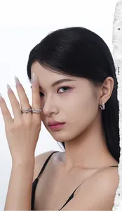 Detailed view of S925 sterling silver cross ring and pearl earrings set on model