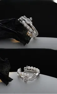 Detailed close-up of double-layer S925 silver ring with white pearls and lava texture