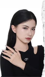 Detail of S925 sterling silver butterfly rings on hand with edgy industrial patterns
