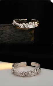 Macro detail of S925 sterling silver snake ring with lava texture and zircon stones