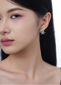 Close-up of S925 sterling silver Chinese style stud earrings with translucent jadeite rings