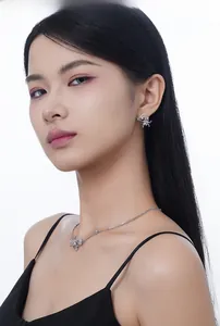 Detailed view of silver S925 spider pattern jewelry set with white translucent rings