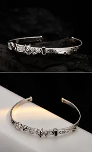 Detailed relief of fox head and paw prints on a retro S925 sterling silver open cuff bracelet