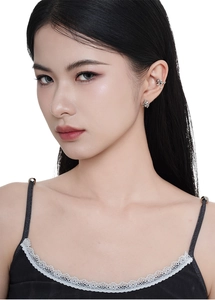 Close-up of S925 sterling silver animal ear cuff and stud set on a female model