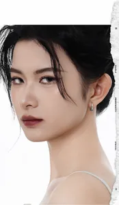 Close-up of S925 sterling silver hoop earrings with woven texture worn by a model