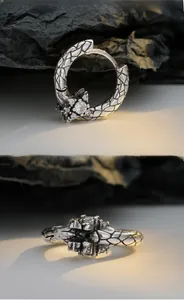 Detailed macro view of S925 silver serpent textured earrings with sparkling zircon stones