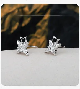 Detail view of S925 sterling silver star stud earrings with cubic zirconia and enamel