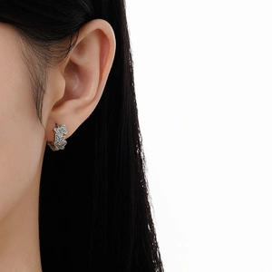 Minimalist S925 sterling silver hoop earrings with hollow butterfly design on female model