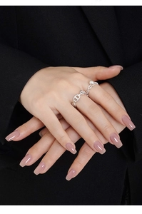 Detail of S925 sterling silver chain ring with pearl accent on model wearing black suit