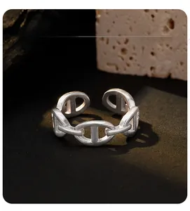 Detail view of silver matte S925 anchor chain ring with adjustable open band design