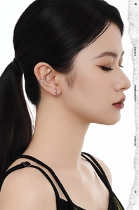 Detail showing irregular S925 silver butterfly earring and ear cuff with red gemstone