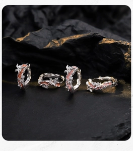 Macro shot of S925 silver irregular floral rings with colorful enamel and zircons