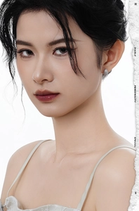 Macro detail of S925 sterling silver pavé-set round stud earrings on a female model