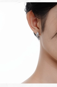 Close-up of minimalist S925 sterling silver stud earrings with full pavé cubic zirconia