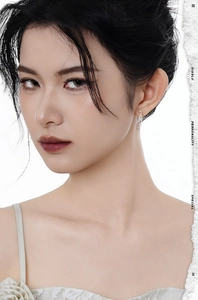 Close-up of elegant S925 sterling silver chain earrings worn by a model with lace details