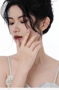 Close-up of S925 silver rope-style ear cuffs and ring set with sparkling zircons