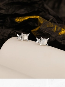 Close-up of S925 sterling silver star stud earrings with agate and sparkling stones