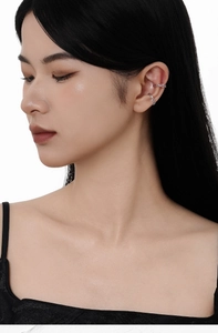 Close-up of S925 sterling silver irregular wavy ear cuff with sparkling micro crystals