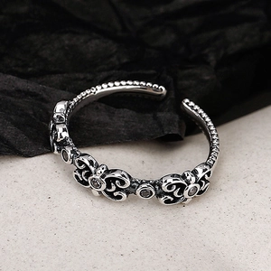 Vintage S925 sterling silver open ring with intricate floral carvings and marcasite stones