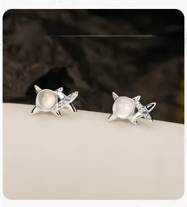 Close-up of S925 sterling silver star earring featuring white opal and zircon micro-paving