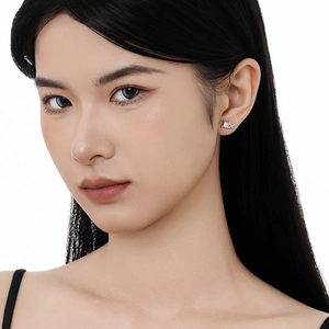 Elegant S925 sterling silver cat stud earrings with white moonstone on model