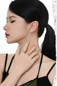 Model wearing elegant S925 sterling silver pearl earrings and matching floral ring set