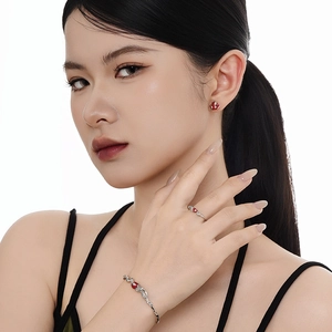 925 silver snake-themed jewelry set with red enamel flower motifs on a female model