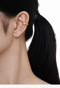 Detailed close-up of gold and silver S925 sterling silver diamond ear cuffs for women