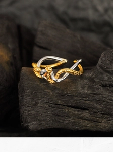 Macro shot of two-tone S925 sterling silver snake ring with micro-set zircon stones