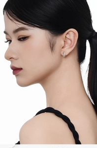 Close-up of S925 sterling silver geometric hoop earrings with sparkling pavé zircons