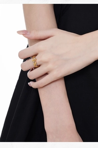 Close-up of S925 sterling silver snake ring with dual-tone woven texture on a model's finger