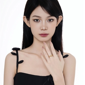 Designer S925 sterling silver winding snake ring with micro-pave stones on model's finger
