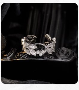 Macro detail of leaf-shaped S925 sterling silver ring with sparkling zircon inlays