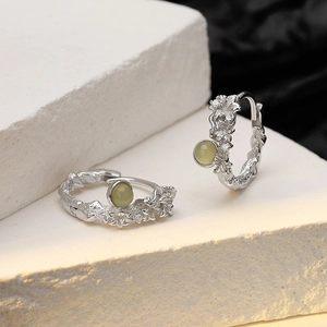 S925 sterling silver floral earrings with irregular texture and light green gemstones