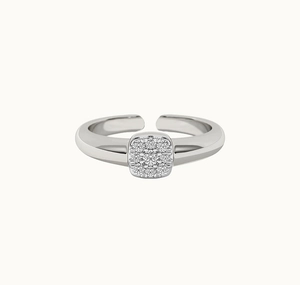 Macro shot of silver square cluster ring featuring sparkling cubic zirconia stones