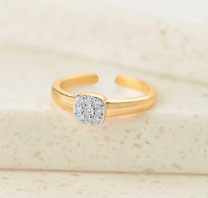 Macro shot of gold-plated square cluster zircon ring with adjustable band and silver setting