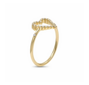 Macro view of a gold S925 silver heart ring with pavé diamonds on a white background