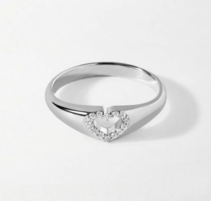 Macro shot of hollow heart ring featuring 14 pavé-set diamonds on S925 silver