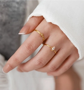 Close-up of S925 sterling silver gold ring set featuring marquise zircon and twisted band
