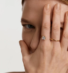 Macro detail of S925 silver gold-plated ring with square cushion-cut zircon stone