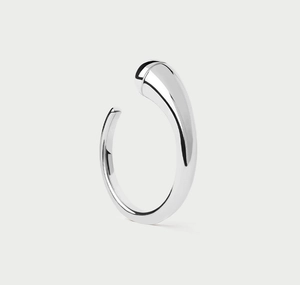 Macro detail of minimalist S925 sterling silver drop ring with a polished finish