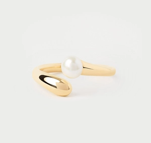 Detailed close-up of open ring featuring white pearl and gold teardrop shaped end
