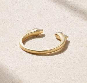 Close-up of golden S925 silver open ring featuring teardrop cubic zirconia on stone