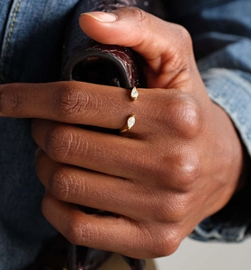 Detailed shot of an adjustable S925 silver ring featuring two oval teardrop zircon stones