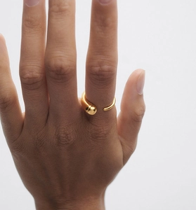 Detail of adjustable gold-plated S925 silver ring featuring a minimalist asymmetric design